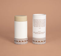 VanMan deodorant balm in an open paper tube displays its natural ingredients and sustainable company philosophy.
