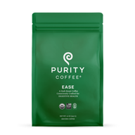 Purity Coffee sells "Ease," a dark roast ground coffee designed to support digestive health, packaged in a green bag with USDA Organic and Bird Friendly certifications.
