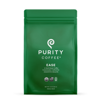 Purity Coffee advertises their "Ease" dark roast whole bean coffee, consciously crafted for digestive health, on a green USDA Organic and bird-friendly certified bag.
