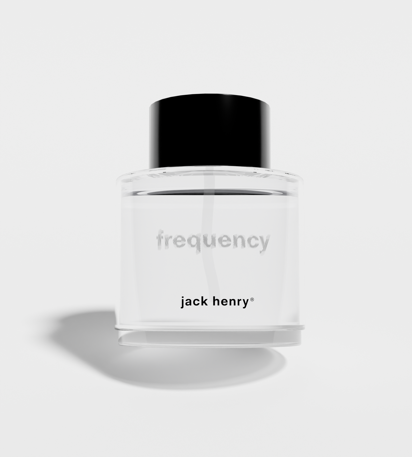 Jack Henry Frequency cologne bottle sits on a white surface.

