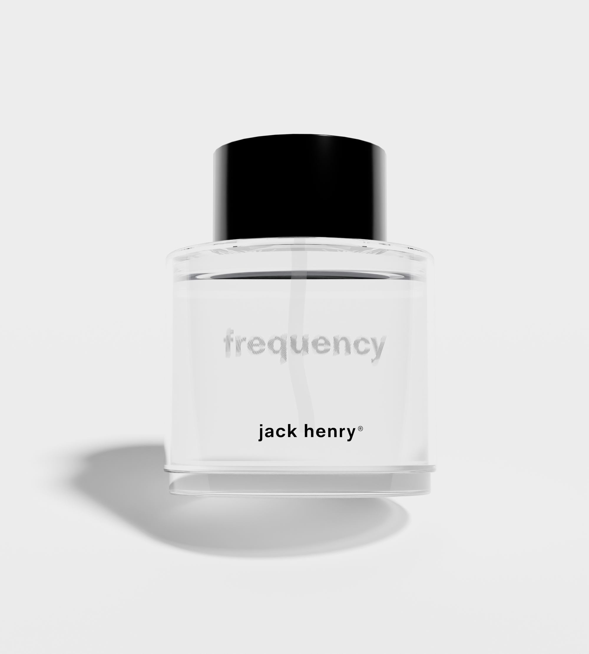Jack Henry Frequency cologne bottle sits on a white surface.
