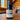 Rogue Evergreens Grand Fir essential oil bottle sits on a wooden table indoors.
