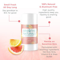 Breathe Naturals Grapefruit Lemon deodorant sits beside sliced grapefruit and lemon, advertising its natural ingredients for sensitive skin.
