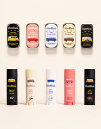 VanMan's displays colorful beeswax lip balms, including peppermint, vanilla, grapefruit, tallow, and bison flavors, featuring vintage-style camper van designs.