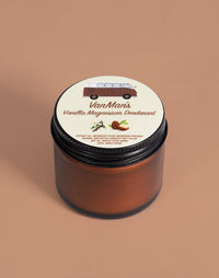 VanMan's Vanilla Magnesium Deodorant jar features a vintage van graphic and lists natural ingredients for odor protection.
