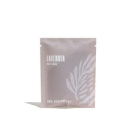 Urb Apothecary sells lavender bath soak in a pale gray package with a leaf design.
