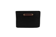 Urban Southern presents a black felt organizer with a brown leather label on a white background.
