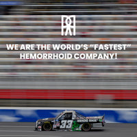 A black #33 stock car branded "RRHOID RAGE" races on a track, advertising the world's "fastest" hemorrhoid company.
