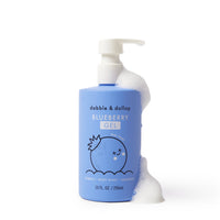 Dabble & Dollop blueberry gel bubbles from the pump of a blue bottle, showcasing a tear-free body wash and shampoo for kids.
