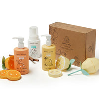 Dabble & Dollop presents their kids' bath set with tangerine, lemon, and vanilla scents alongside charming citrus-themed paper crafts.
