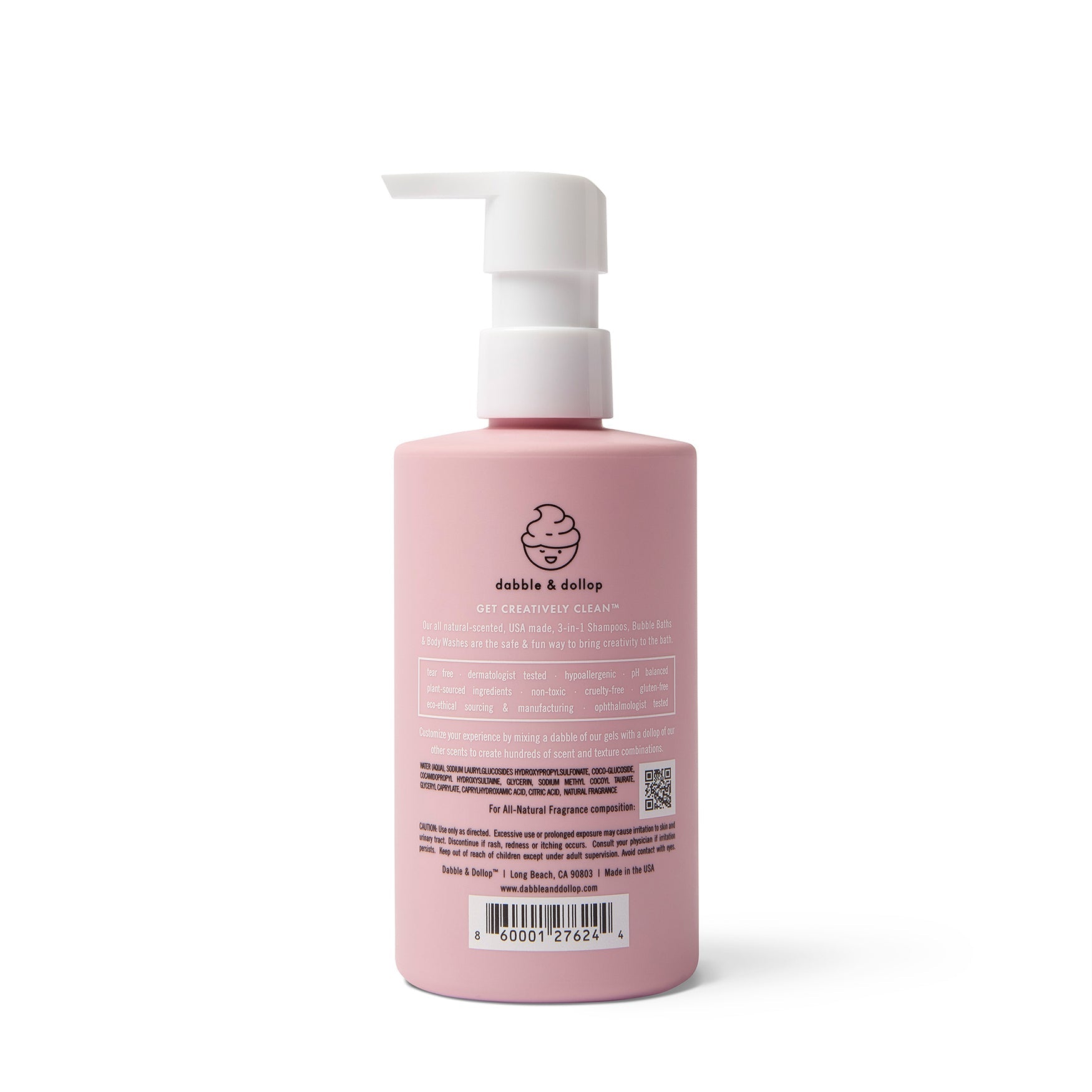 A pink bottle of Dabble & Dollop 3-in-1 shampoo, bubble bath, and body wash sits upright with its pump dispenser visible.
