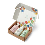 Discover Dabble & Dollop's children's bath product set featuring coconut, vanilla, and honeydew scented body wash and shampoo, packaged in a charmingly decorated box.