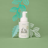Dabble Ducky infant wash bottle sits among decorative paper leaves, promoting a fragrance-free delicate cleanser for newborns.
