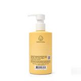 Dabble & Dollop all-natural shampoo in a yellow bottle offers tear-free, dermatologist-tested, and cruelty-free bathing.

