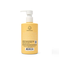 Dabble & Dollop all-natural shampoo in a yellow bottle offers tear-free, dermatologist-tested, and cruelty-free bathing.
