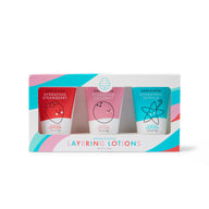 Dabble & Dollop presents a set of three hydrating layering lotions in strawberry, coconut, and vanilla scents, packaged in a colorful gift box.
