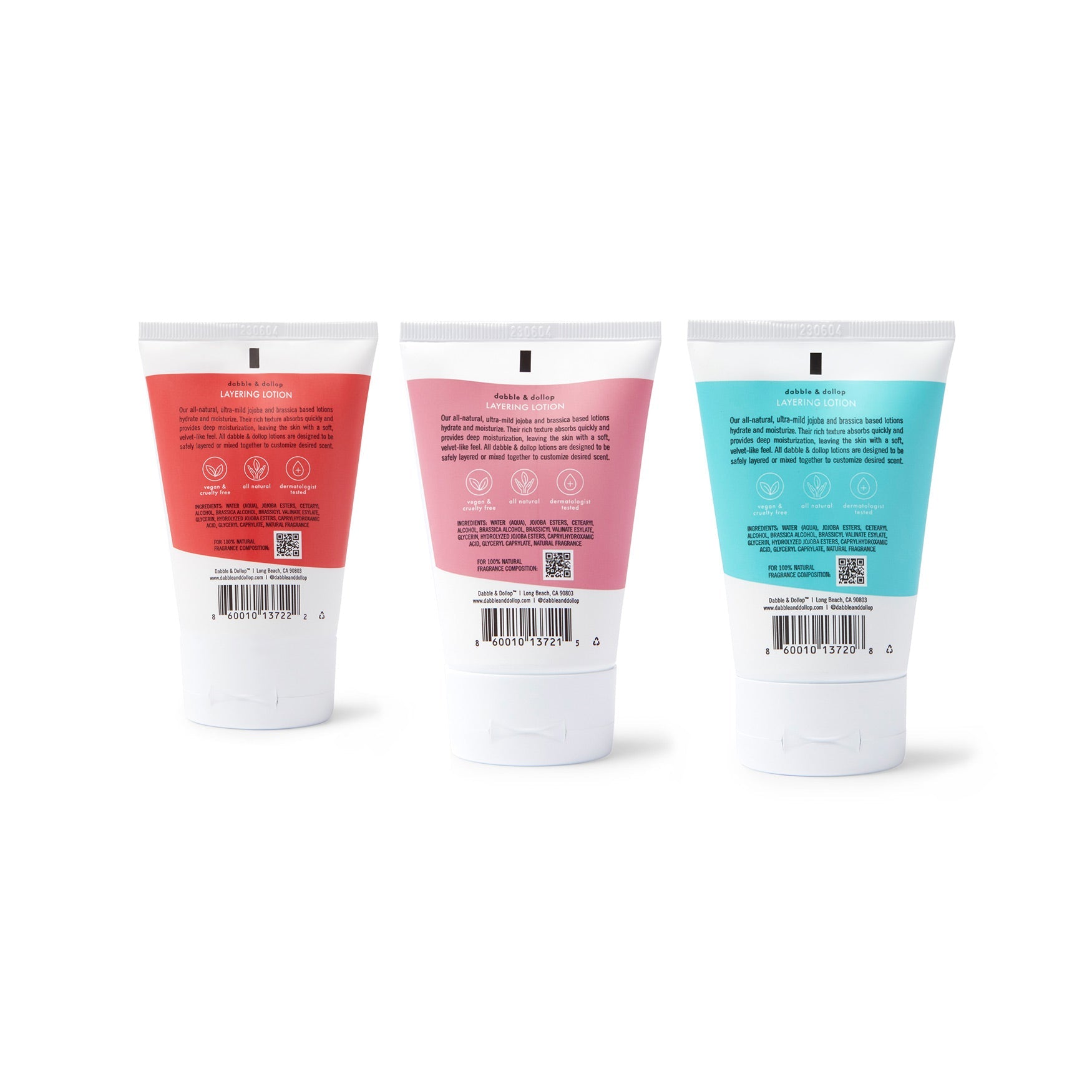 Dabble & Dollop displays its all-natural, jojoba and brassica-based layering lotions designed for hydration and customizable scents in red, pink, and blue tubes.
