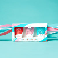 Dabble & Dollop presents a set of three hydrating layering lotions in strawberry, coconut, and vanilla scents within a colorful box.
