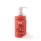 Dabble & Dollop strawberry gel body wash bottle sits amidst bubbly foam.
