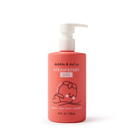 A coral bottle of Dabble & Dollop strawberry gel, usable as bubbles, body wash, or shampoo, features a cute strawberry character.
