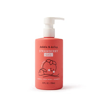 A coral bottle of Dabble & Dollop strawberry gel, usable as bubbles, body wash, or shampoo, features a cute strawberry character.
