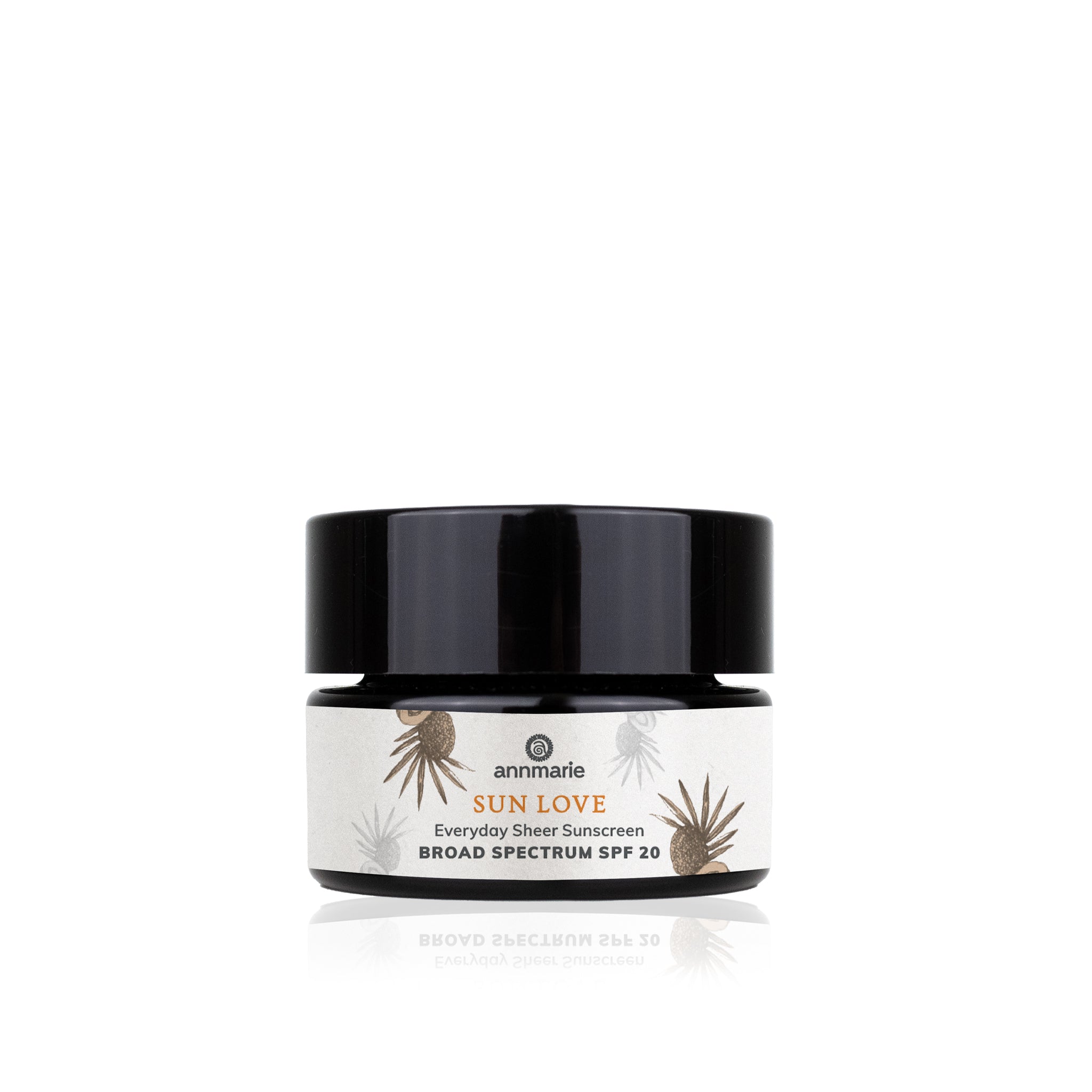 Annmarie Sun Love SPF 20 sits on a white surface, advertising everyday sheer sunscreen.
