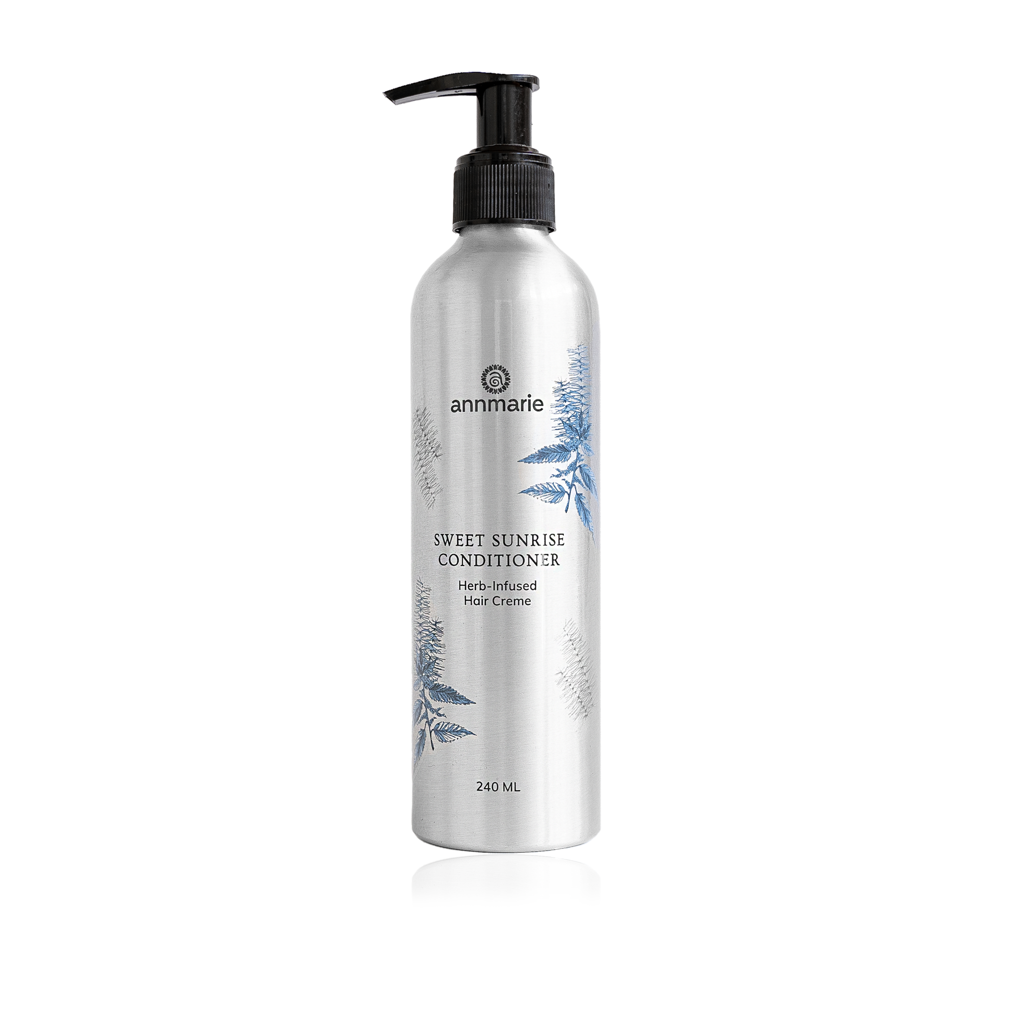 Annmarie Sweet Sunrise Conditioner in a silver bottle with a black pump dispenser showcases herb-infused hair care.
