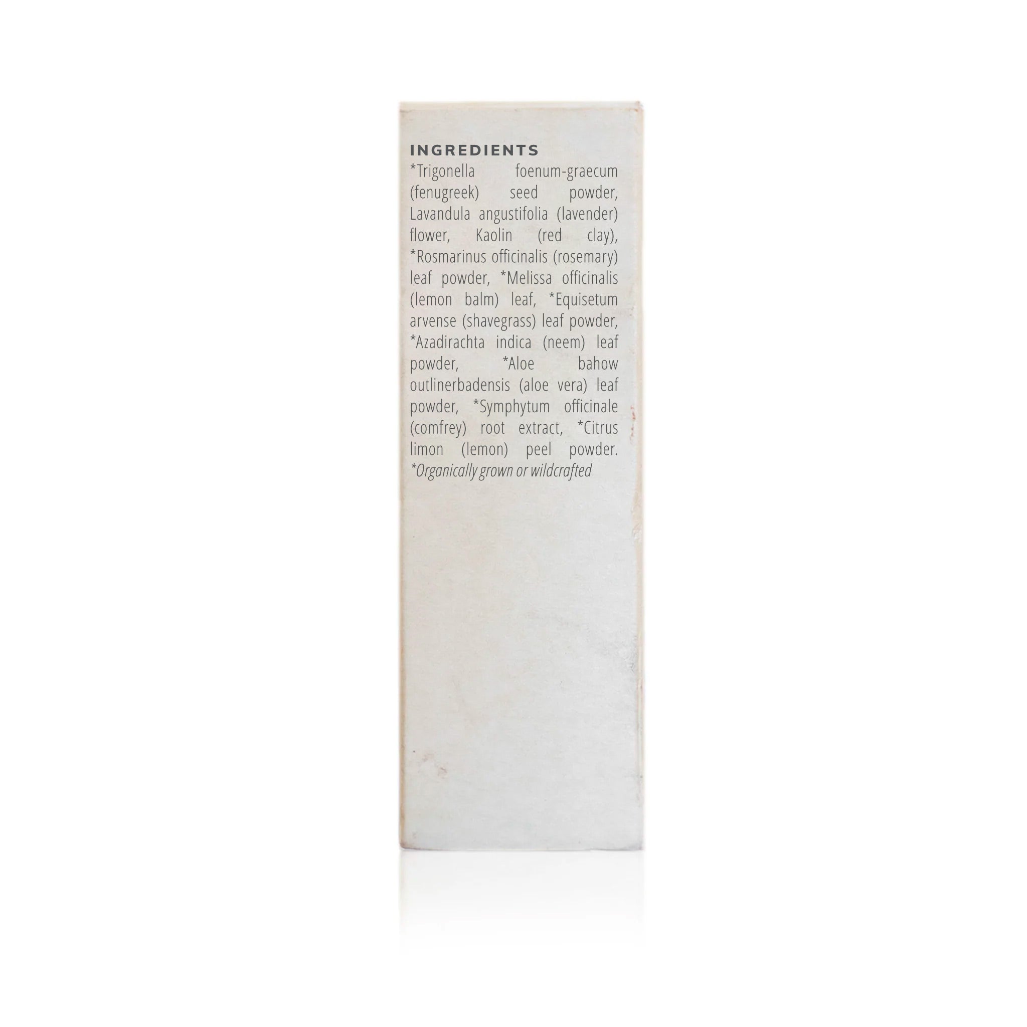Close-up shows the list of ingredients, including fenugreek, lavender, rosemary, and aloe vera, for an organically grown skincare product.
