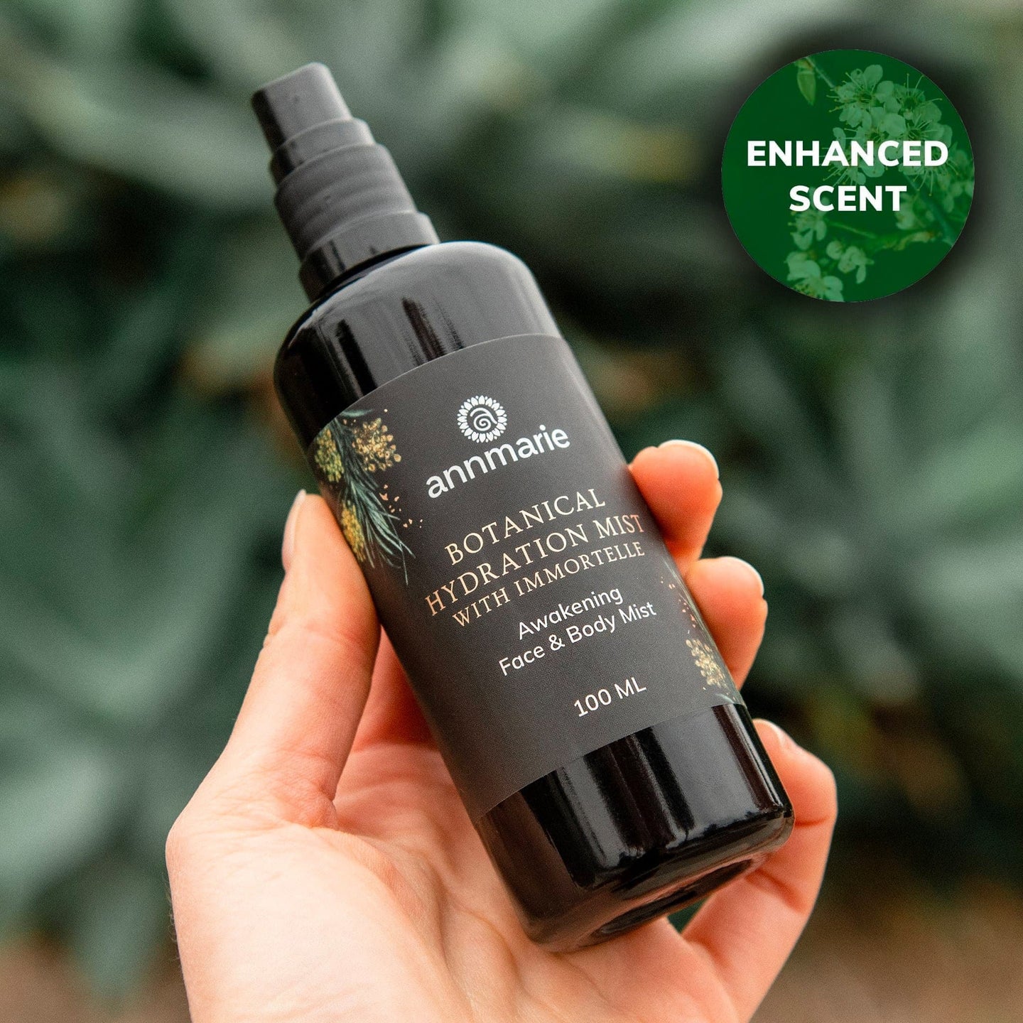 Person holds Annmarie Botanical Hydration Mist, an awakening face and body mist with enhanced scent.
