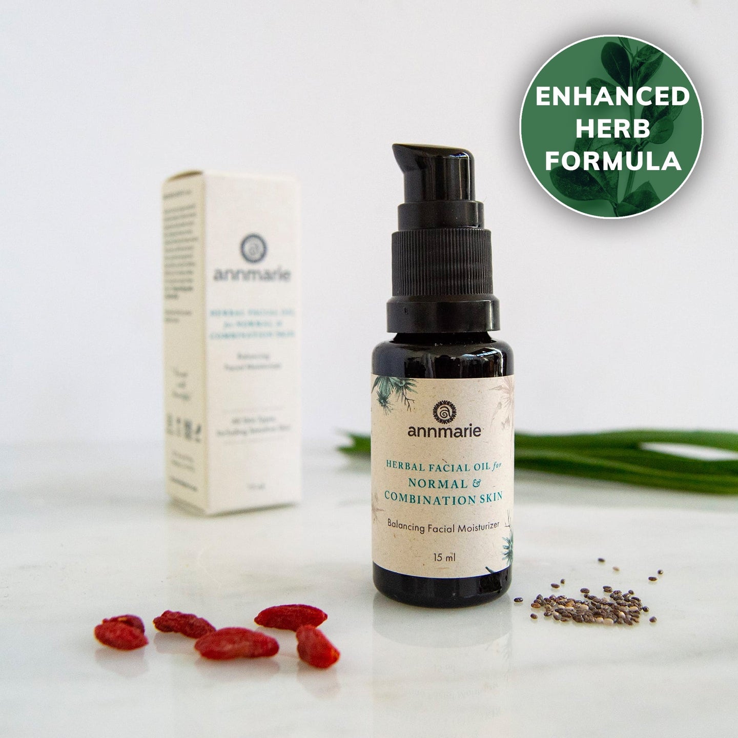 Annmarie's herbal facial oil for normal and combination skin, with enhanced herb formula, sits beside goji berries and chia seeds.
