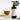 Annmarie Coconut Body Oil, an herb-infused moisturizer, sits beside calendula petals and a wooden bowl on a white marble surface.
