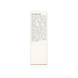 Close-up shows the skincare product ingredients list, featuring grape seed oil, camellia, rosehip, lavender, and pomegranate, emphasizing organic and natural beauty.
