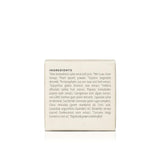 Read the skincare product label listing natural ingredients like aloe vera, pearl powder, and turmeric.
