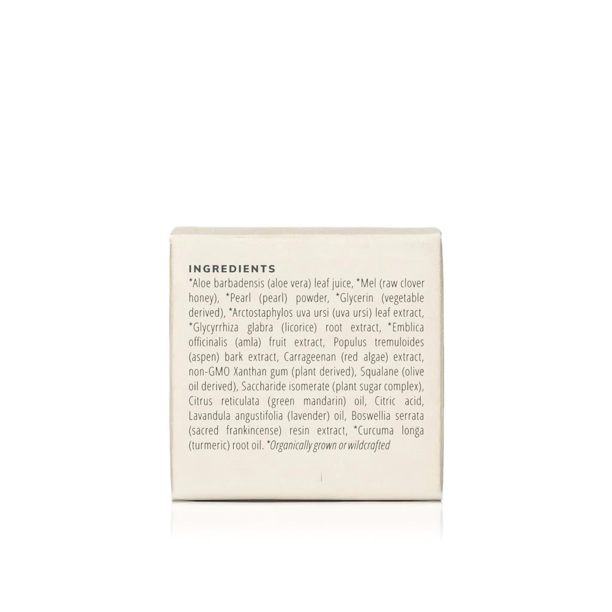 Read the skincare product label listing natural ingredients like aloe vera, pearl powder, and turmeric.
