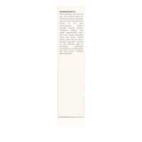 Close-up of a product label lists natural and organic ingredients like aloe vera, coconut oil, bamboo, and lavender for skincare or beauty.

