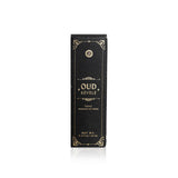 Showcases the elegant Oud Révélé luxury essential oil blend packaging.
