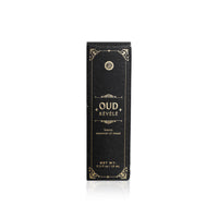 Showcases the elegant Oud Révélé luxury essential oil blend packaging.
