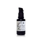 Bottle of Radiate Facial Moisturizing Oil sits on a white surface.
