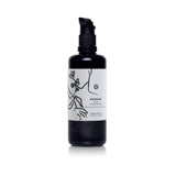 A black bottle holds Renew facial cream cleanser with botanical illustrations and a pump dispenser.
