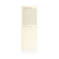 Close-up shows the ingredients list, featuring both scientific and common names of naturally derived oils and plant extracts, for a beauty or skincare product.
