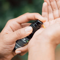 A person pumps Annmarie Wild Fruit Serum onto their hand.
