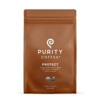 Purity Coffee displays its Protect light-medium roast whole bean coffee in an organic USDA certified and Bird Friendly sealed brown bag.
