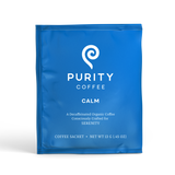 Purity Coffee presents its Calm blend in a blue sachet of decaffeinated organic coffee crafted for serenity.
