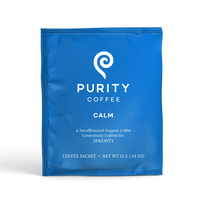 Purity Coffee presents its Calm blend in a blue sachet of decaffeinated organic coffee crafted for serenity.
