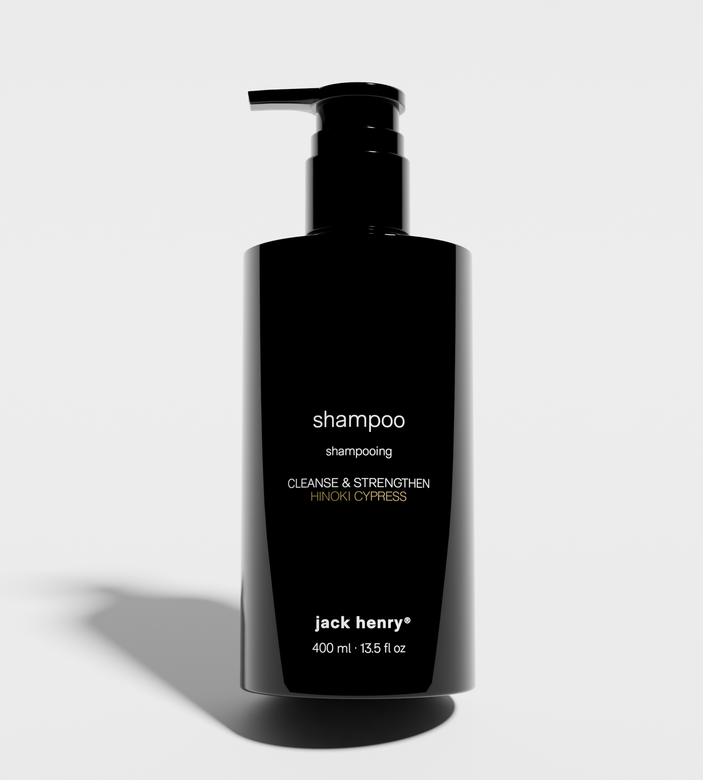 Jack Henry's black bottle presents its Hinoki Cypress shampoo designed to cleanse and strengthen hair.
