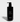 Jack Henry's black bottle presents its Hinoki Cypress shampoo designed to cleanse and strengthen hair.
