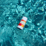 Breathe Naturals deodorant floats in shimmering turquoise pool water.
