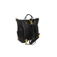 A black leather convertible tote bag shows off its adjustable shoulder straps and gold hardware.
