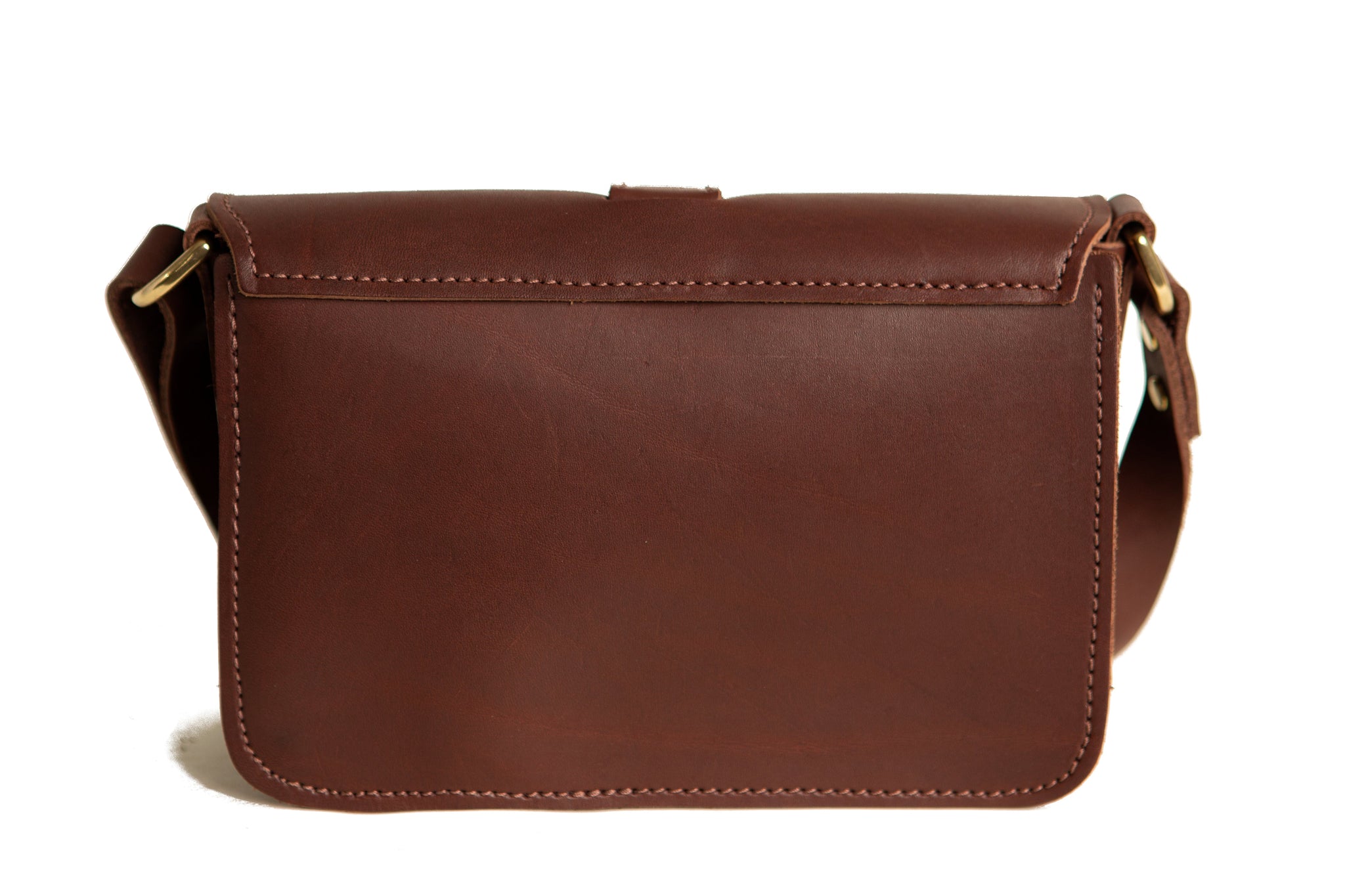 The brown leather crossbody bag features detailed stitching and a gold buckle closure.

