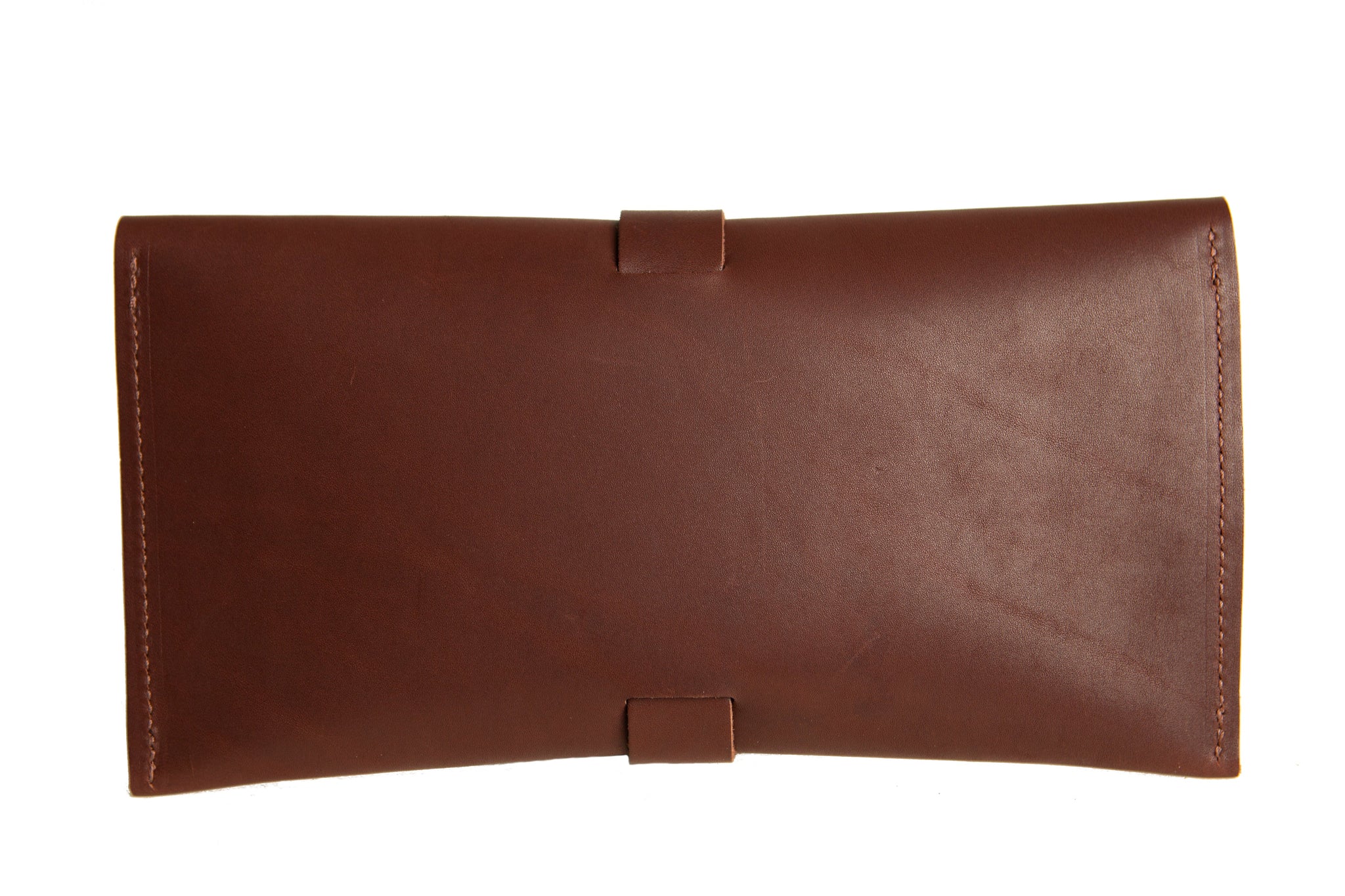 A brown leather envelope-style wallet features a simple strap closure.
